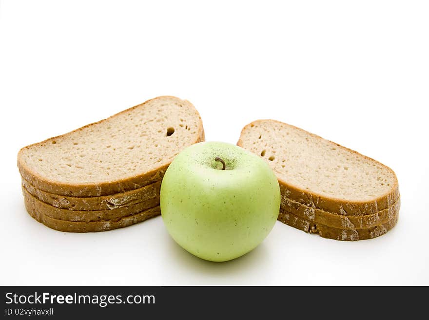 Cut bread with green apple. Cut bread with green apple