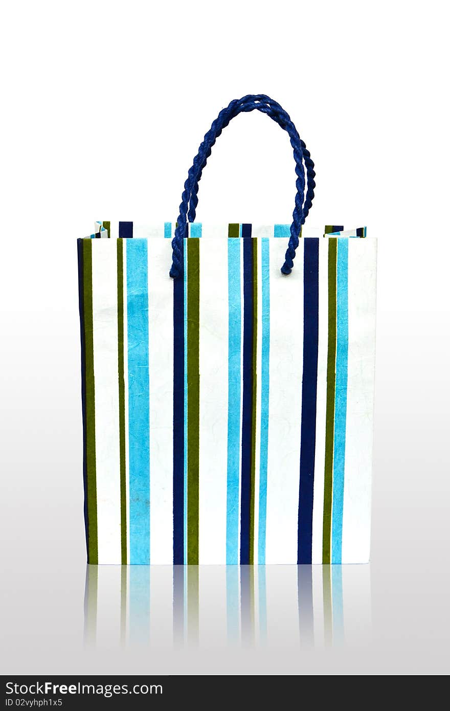 Paper stripes blue white bag on white background at has the shade. Paper stripes blue white bag on white background at has the shade