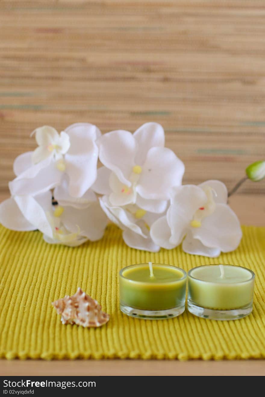 Essential  candle and flower in health spa for spa treatment.