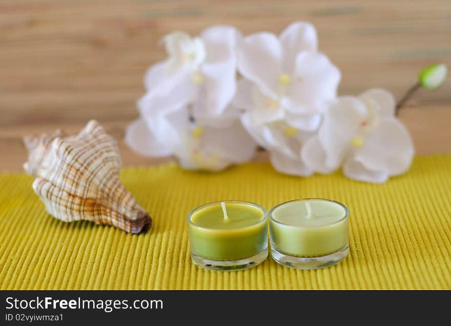 Essential  candle and flower in health spa for spa treatment.