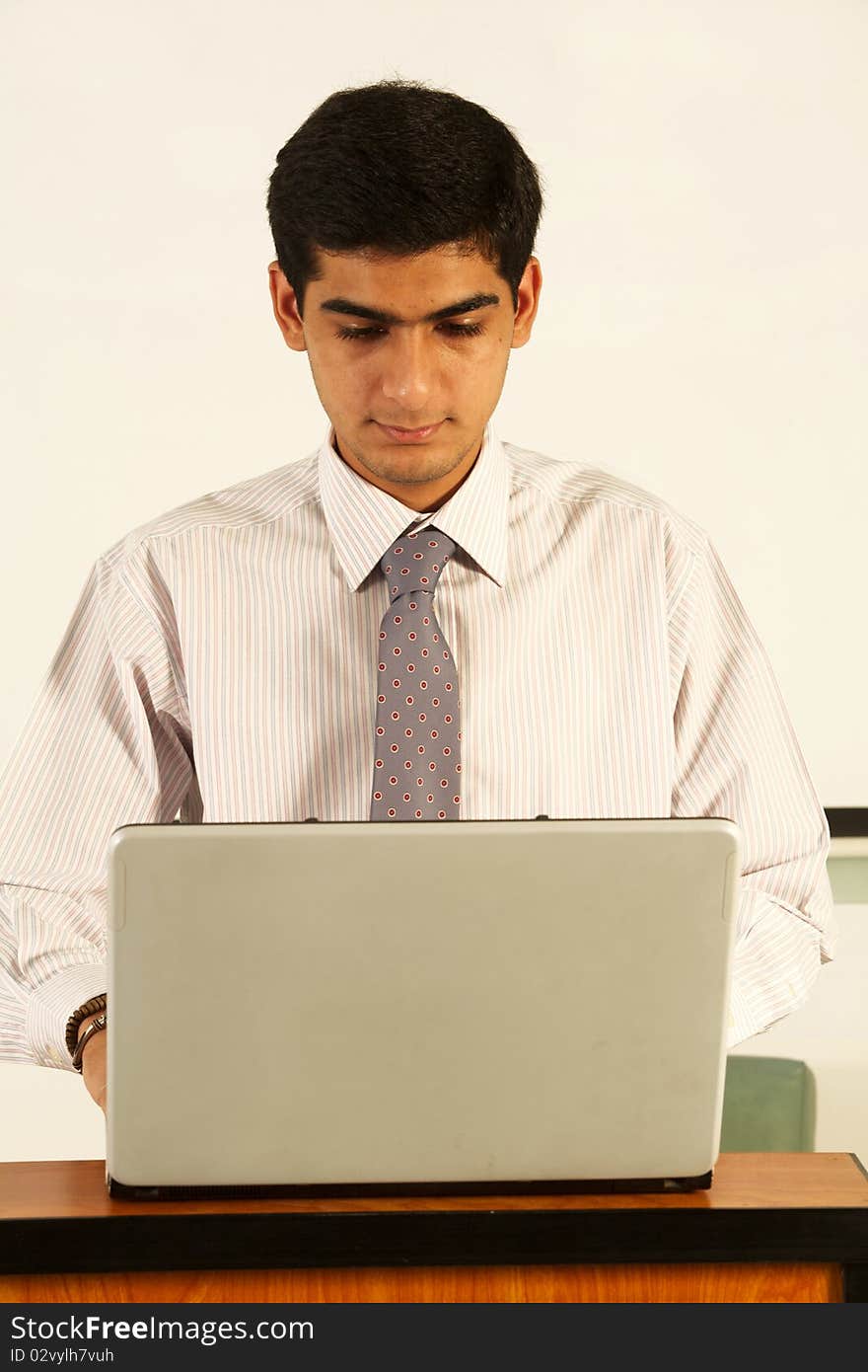 Asian male student in a classroom.