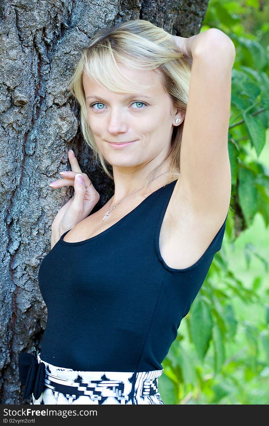 Girl relaxing on the meadow against