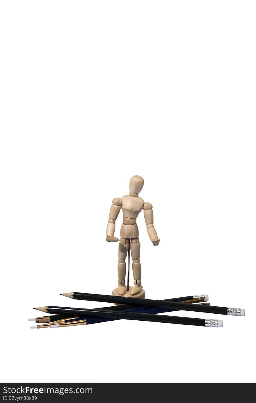 Miniature Artist Wooden Model with Pencils and Brushes Isolated on White. Miniature Artist Wooden Model with Pencils and Brushes Isolated on White