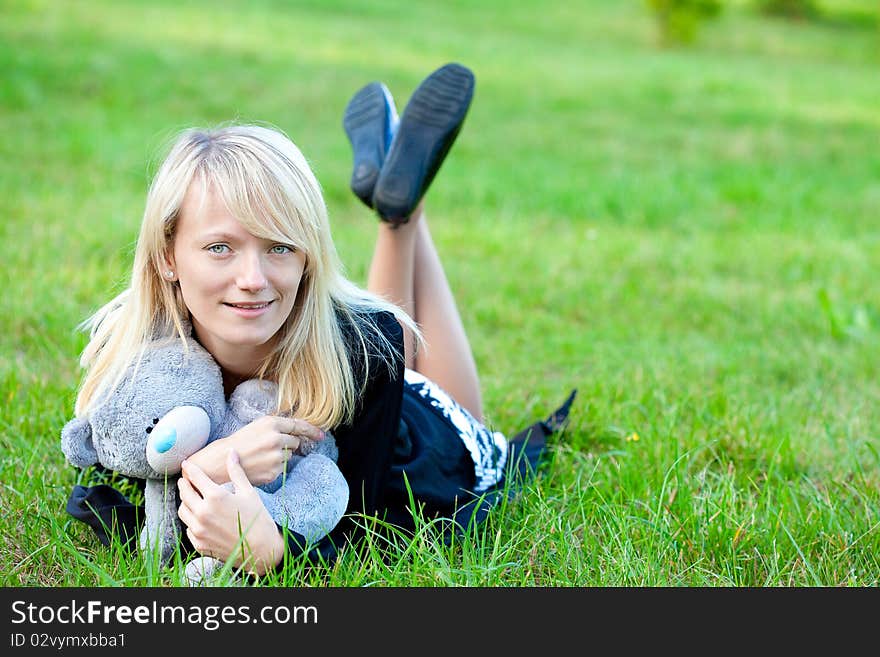 Girl relaxing on the meadow against