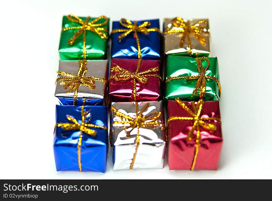 Many colorful gift boxes on a white background