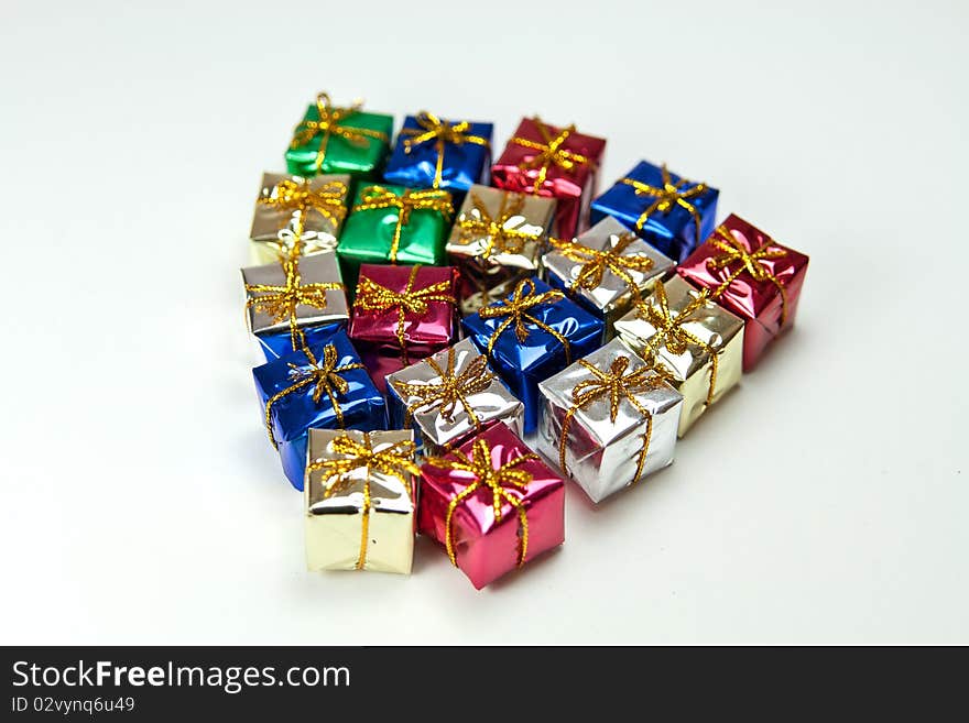 Many colorful gift boxes on a white background