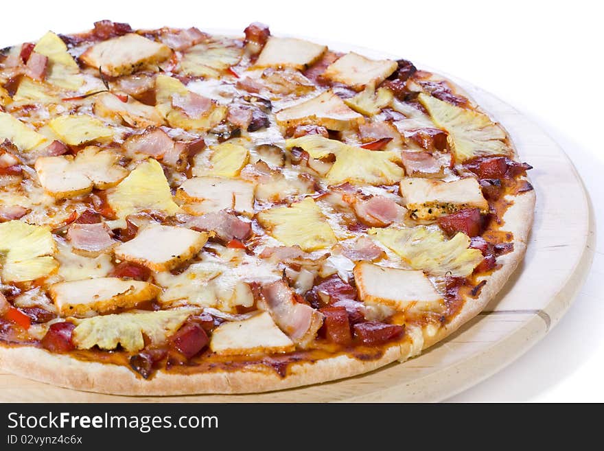 Ham and pineapple pizza on white ground