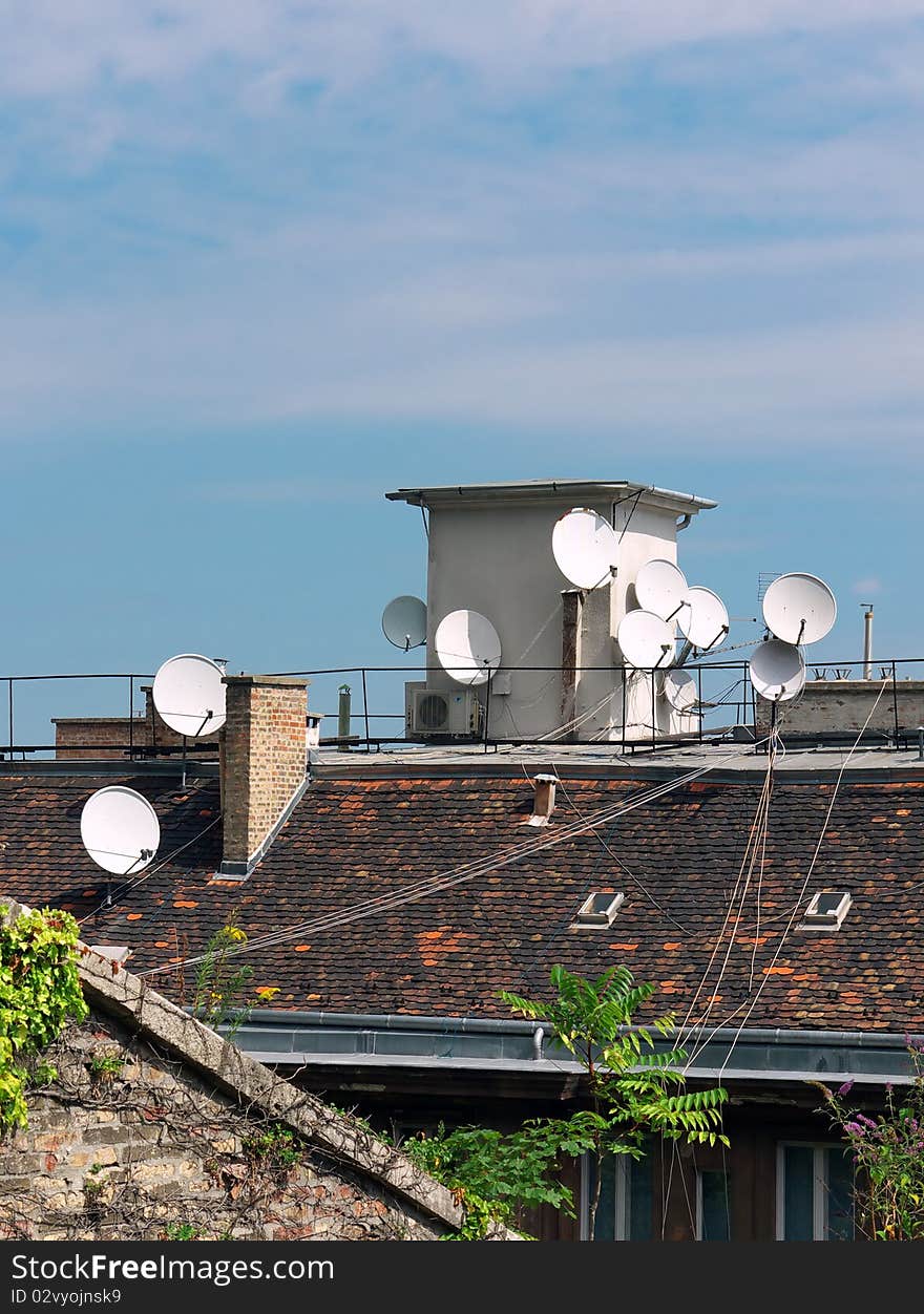 Roof with many satellite antennas. Roof with many satellite antennas