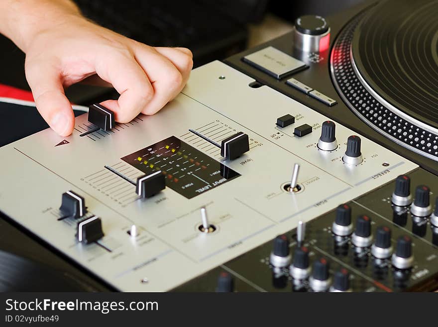 Hand Of A Dj Adjusting The Crossfader