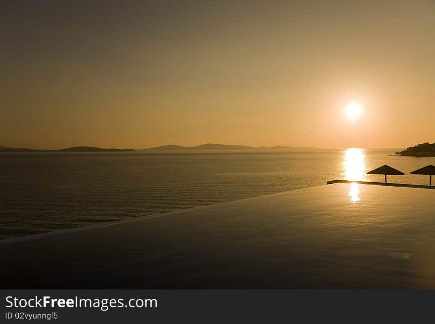 Sunset over port of Mykonos, Greece