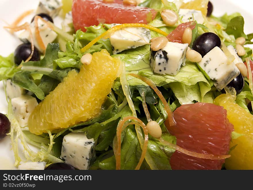 Salad made of citrus, grape and cheese. Salad made of citrus, grape and cheese