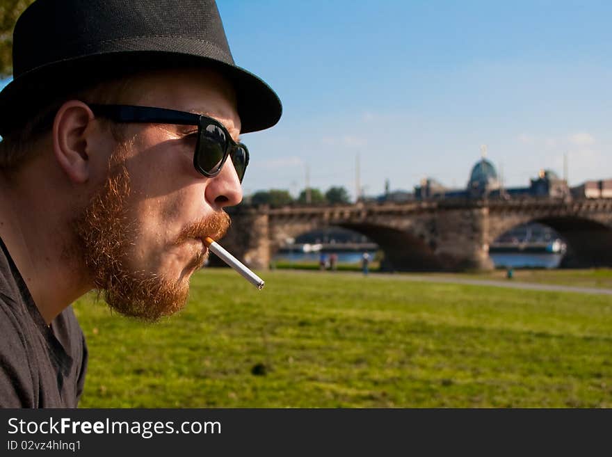 Profile man with a cigarette in dresden