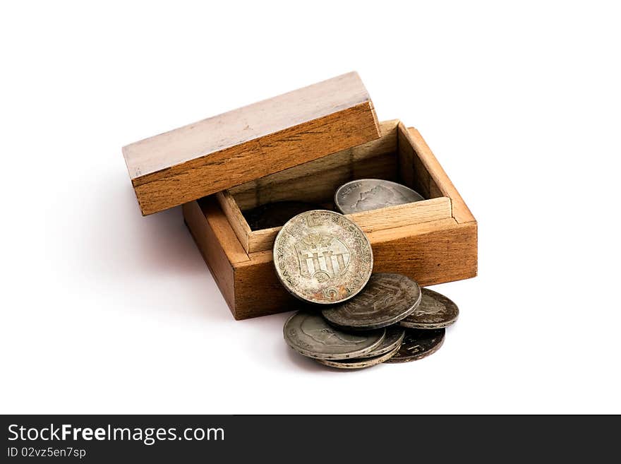 Old hungarian silver coins in a wooden box. The coins were made in 1947, with Kossuths face and the hungarian coat of arms on them.