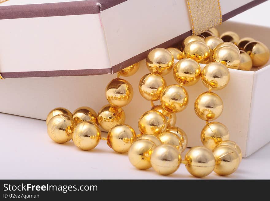 Golden balls in a white gift box