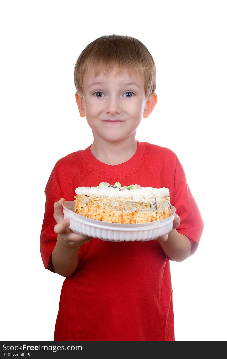 Happy boy with a cake on a white background