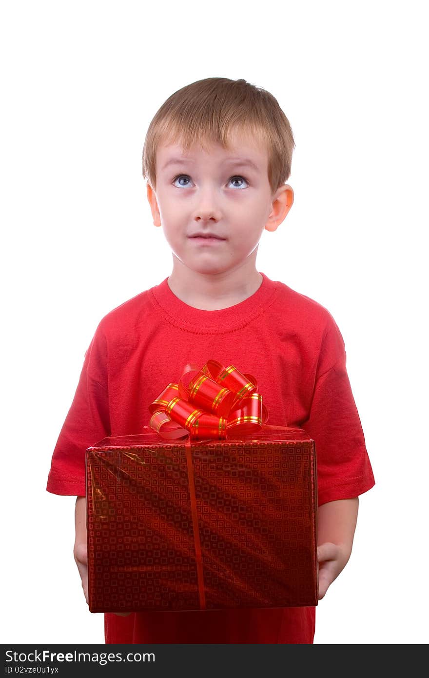 Happy boy thinks about the gift, isolated on a white background