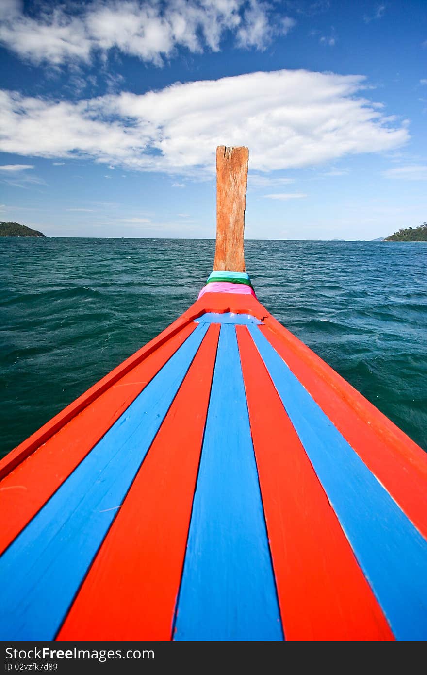 Bow of a traditional thai longtail boat in sea