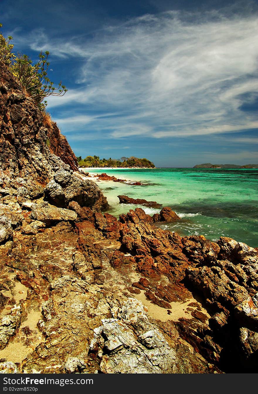 The sky, the rocks, the sand, and the water make malcapuya's shoreline such a wonder to behold. The sky, the rocks, the sand, and the water make malcapuya's shoreline such a wonder to behold.