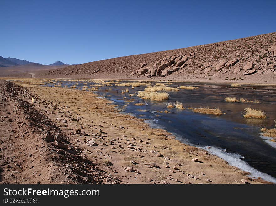 The River of San Pedro, crossing the desert of Atacama, with ice formation over it, and the Licancabur Vulcan at back. The River of San Pedro, crossing the desert of Atacama, with ice formation over it, and the Licancabur Vulcan at back.