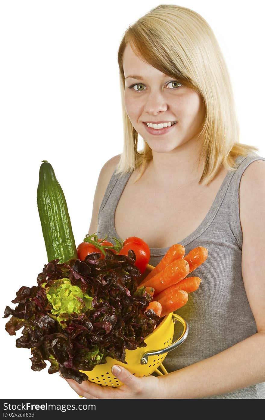 Young woman presenting fresh vegetables - isolated on white. Young woman presenting fresh vegetables - isolated on white