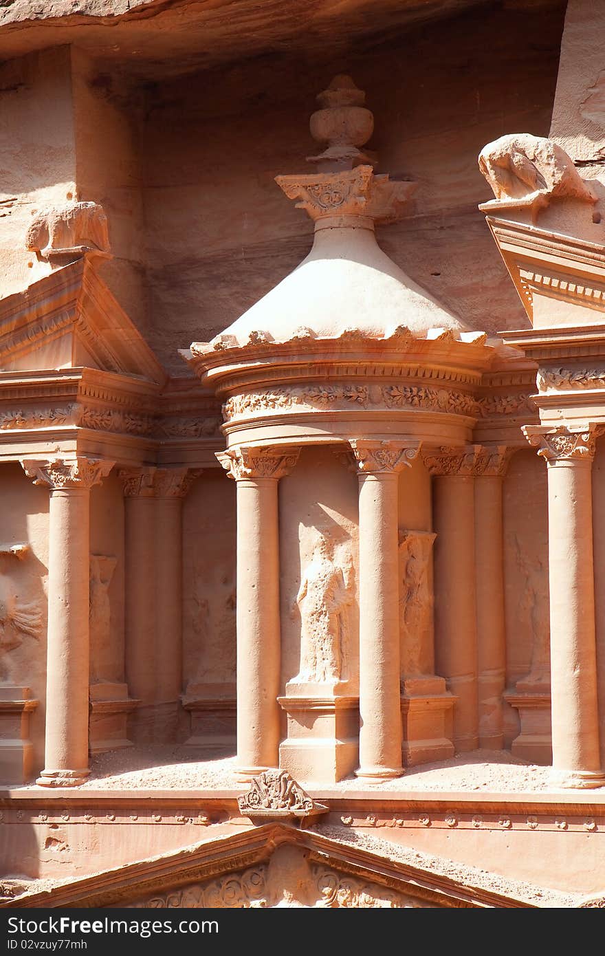 Detail of 3.5 m high urn in the middle of second level of Treasury (Al-Khazneh) in ancient city of Petra in Jordan. It was carved out of a single rock. It is now an UNESCO World Heritage Site, Petra, Jordan. Detail of 3.5 m high urn in the middle of second level of Treasury (Al-Khazneh) in ancient city of Petra in Jordan. It was carved out of a single rock. It is now an UNESCO World Heritage Site, Petra, Jordan