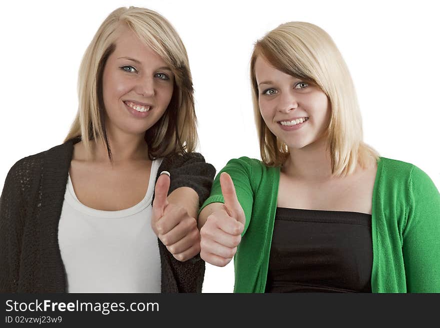 Two young caucasian girlfriends having fun together  isolated over white background. Two young caucasian girlfriends having fun together  isolated over white background