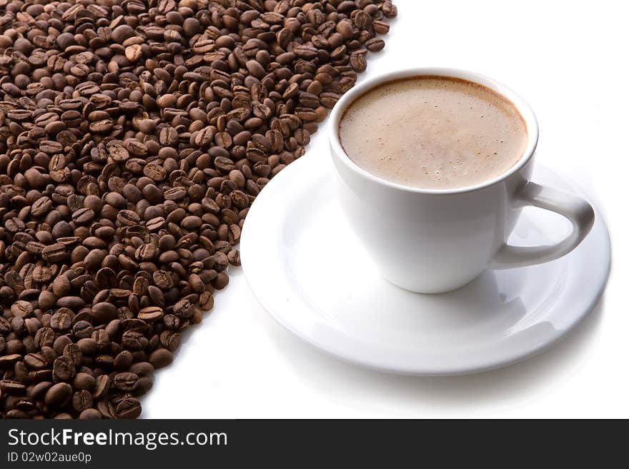 Coffee cup and grain on white background