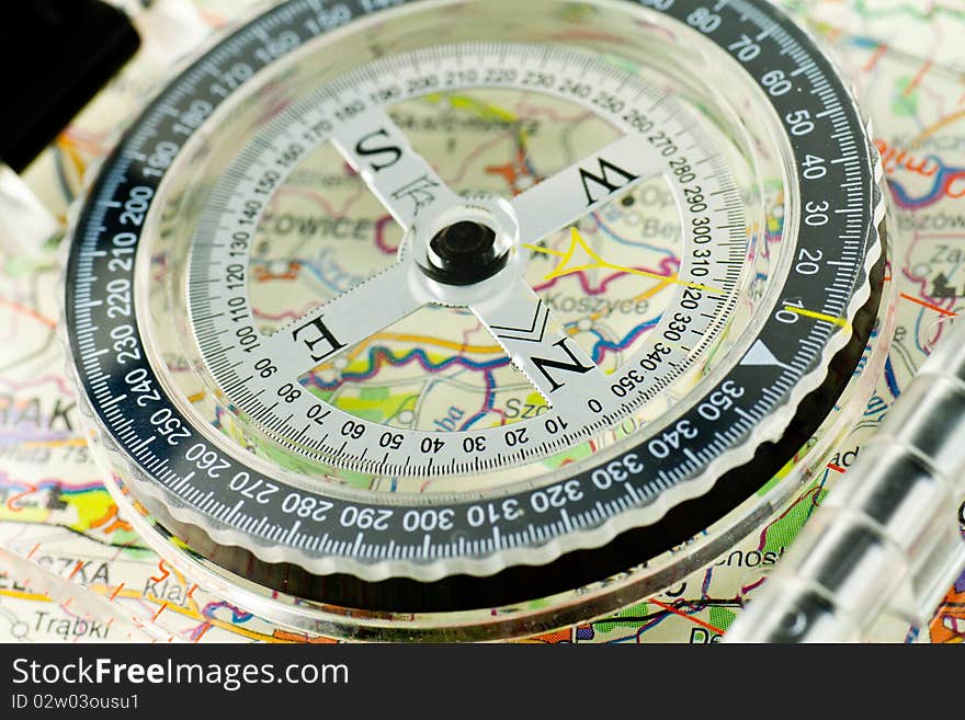 Compass on the map background. Compass on the map background