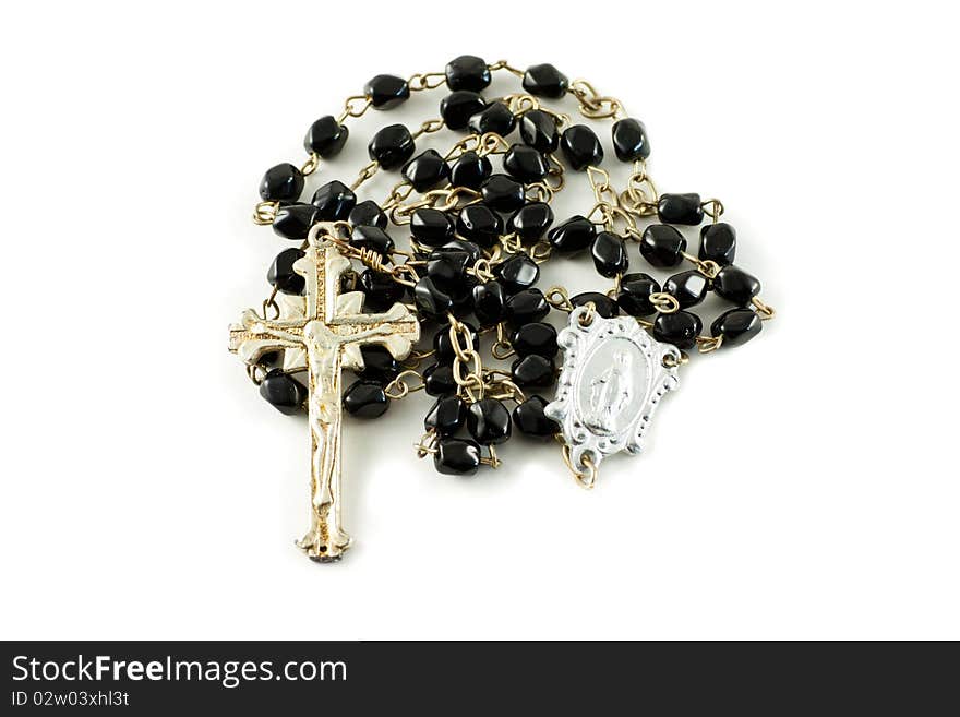 Black rosary on a white background