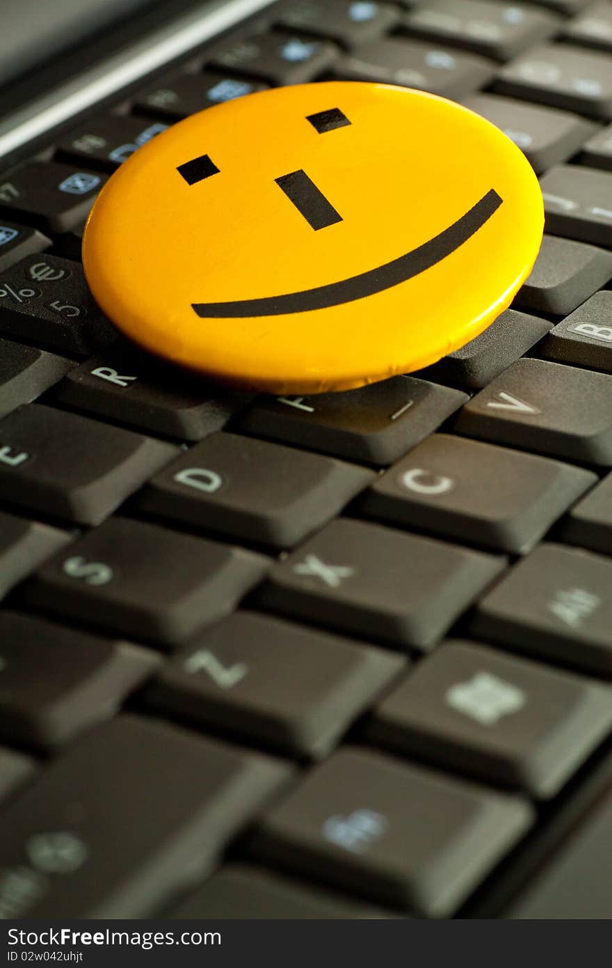 Smile emoticon on the laptop keyboard