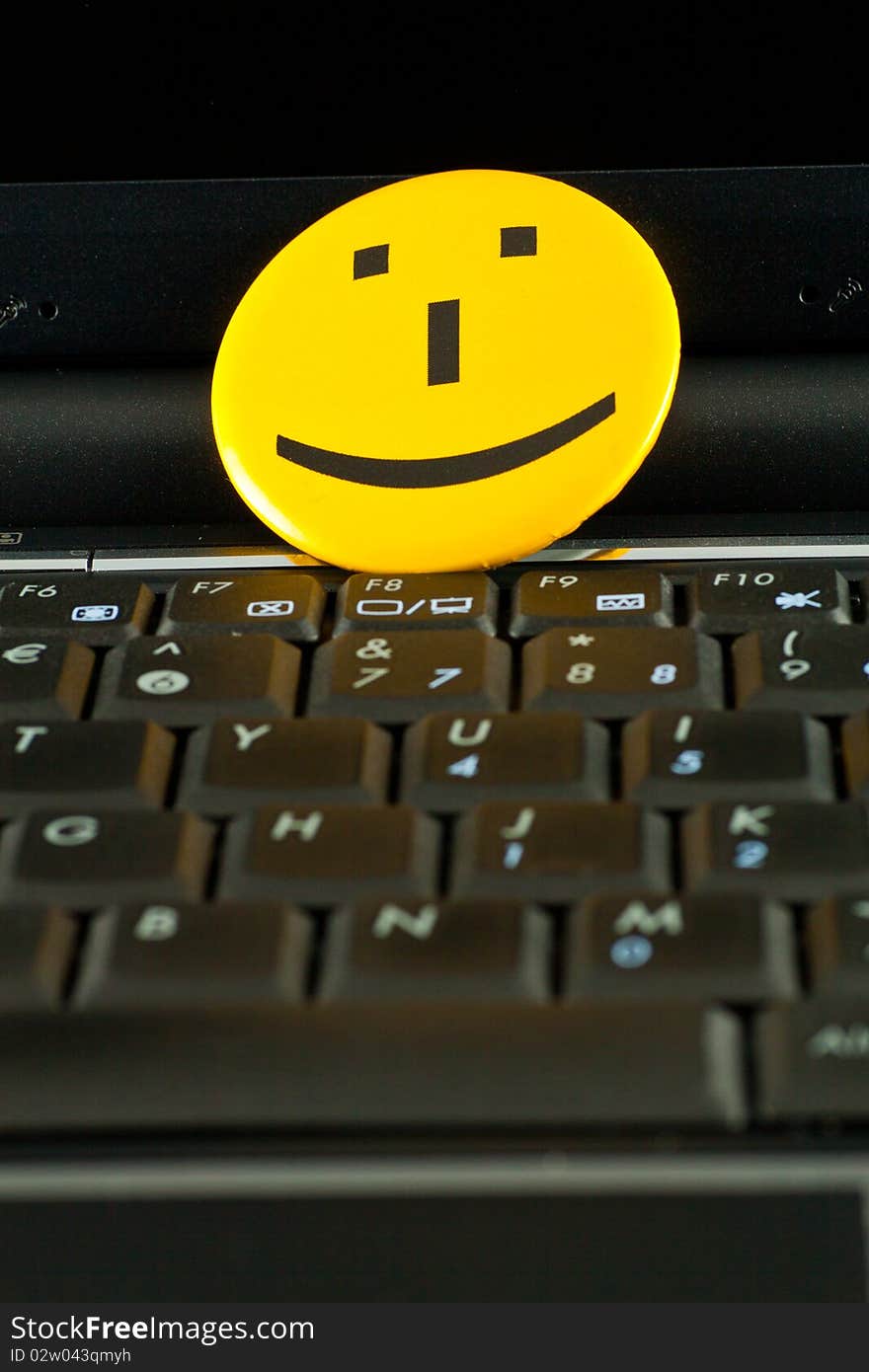 Smile emoticon on the laptop keyboard