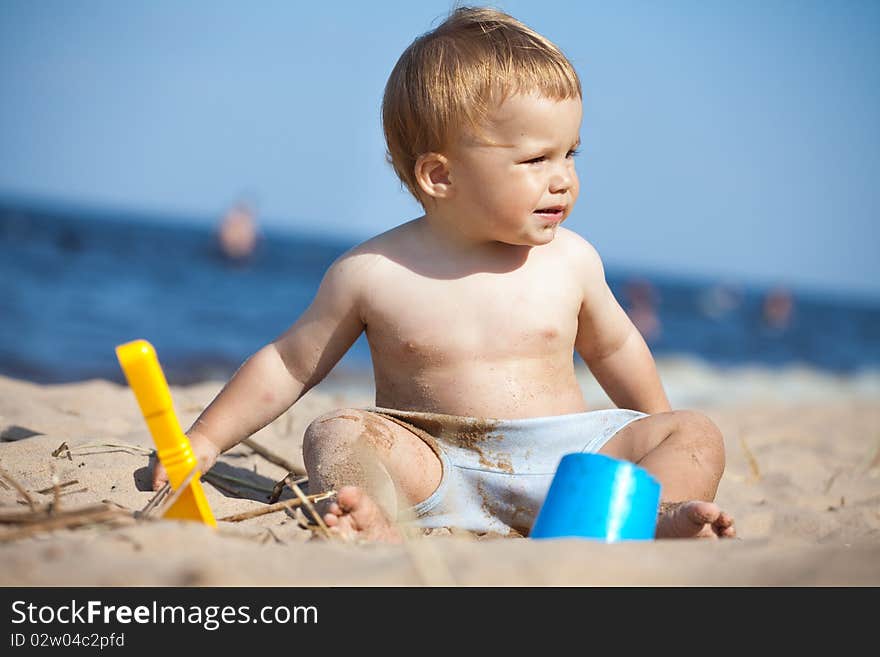 Child playing on a beach. Child playing on a beach