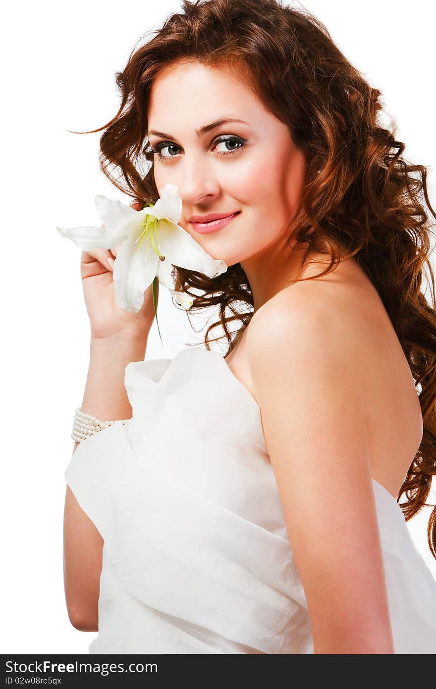 Portrait of charming young girl with a flower