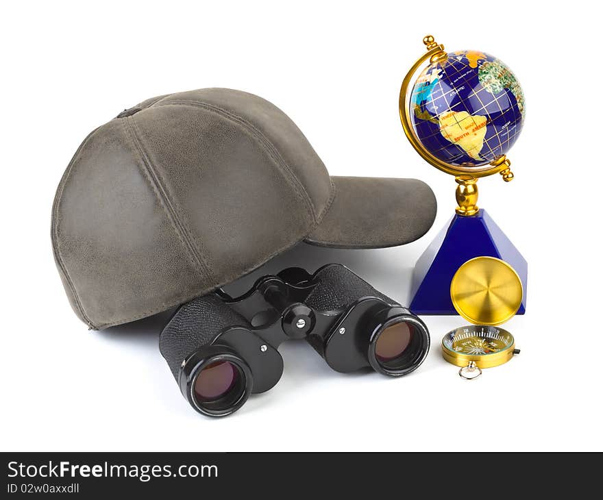 Binoculars, cap, compass and globe