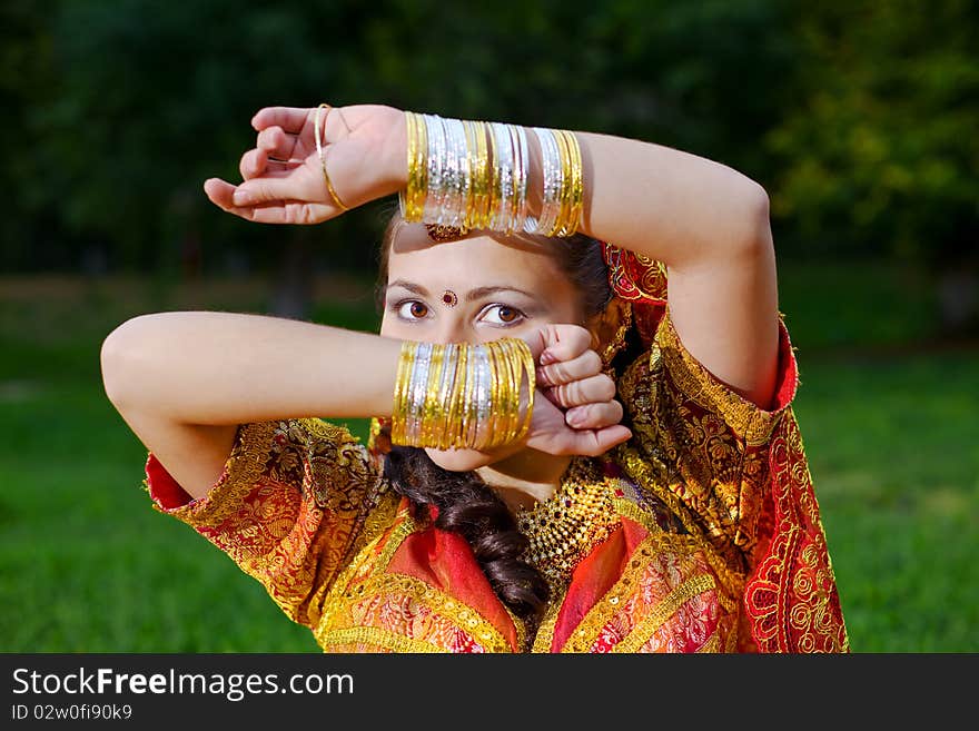 A young Indian woman hiding face