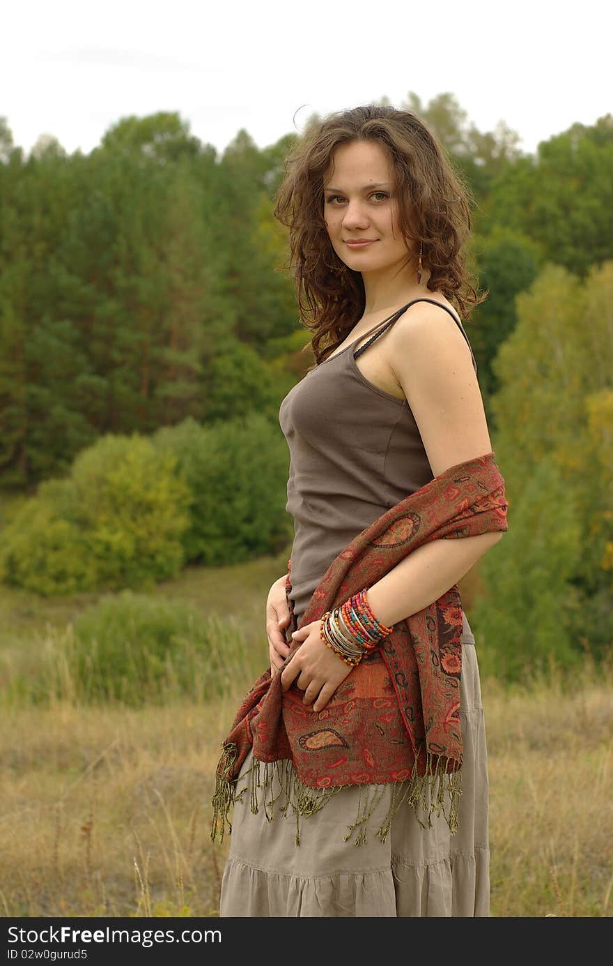 Girl walking in the autumn field. Girl walking in the autumn field