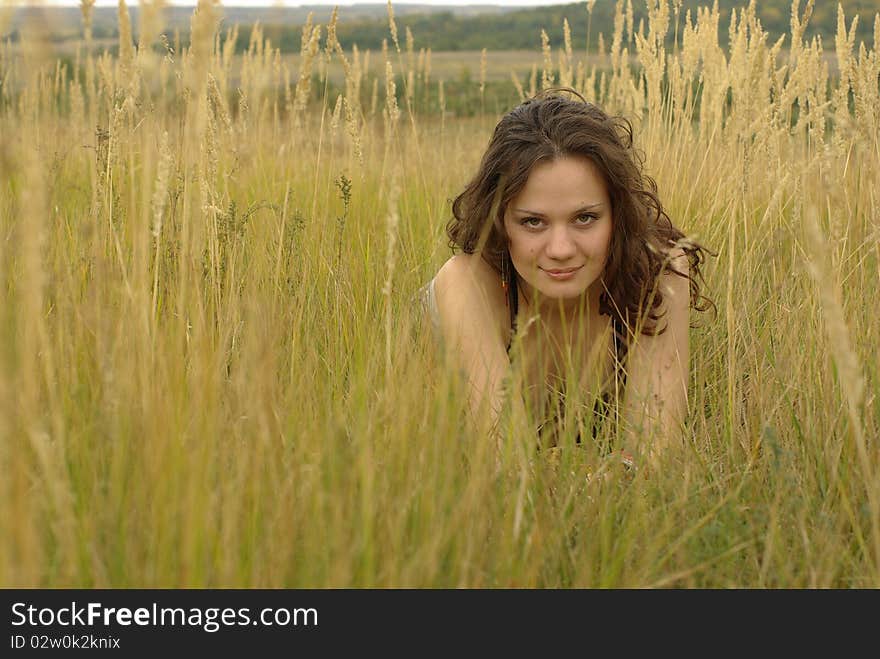 Girl lying in the autumn corn field. Girl lying in the autumn corn field