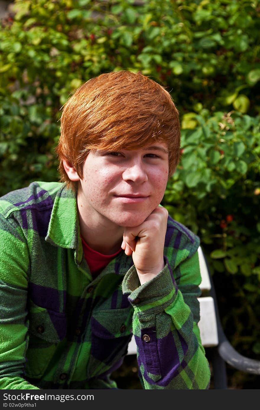 Boy sitting on a bench