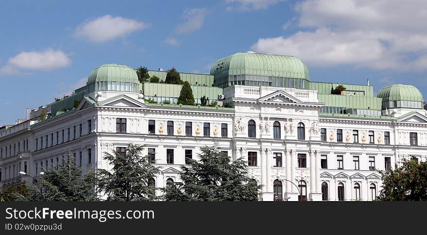 White home building with roof terraces with trees in Vienna. . White home building with roof terraces with trees in Vienna.