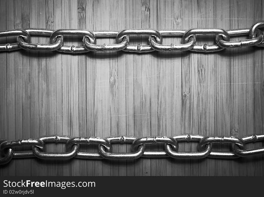 A wooden board with chain