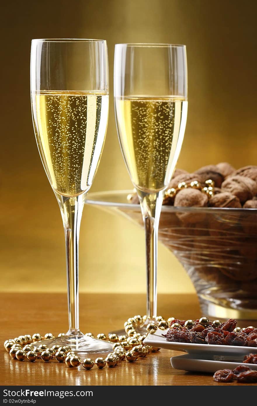 Glasses Of Champagne With Gold Background