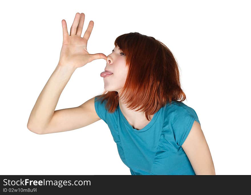 Young redhead woman teasing and showing her tongue, opened palm near nose, half body, isolated