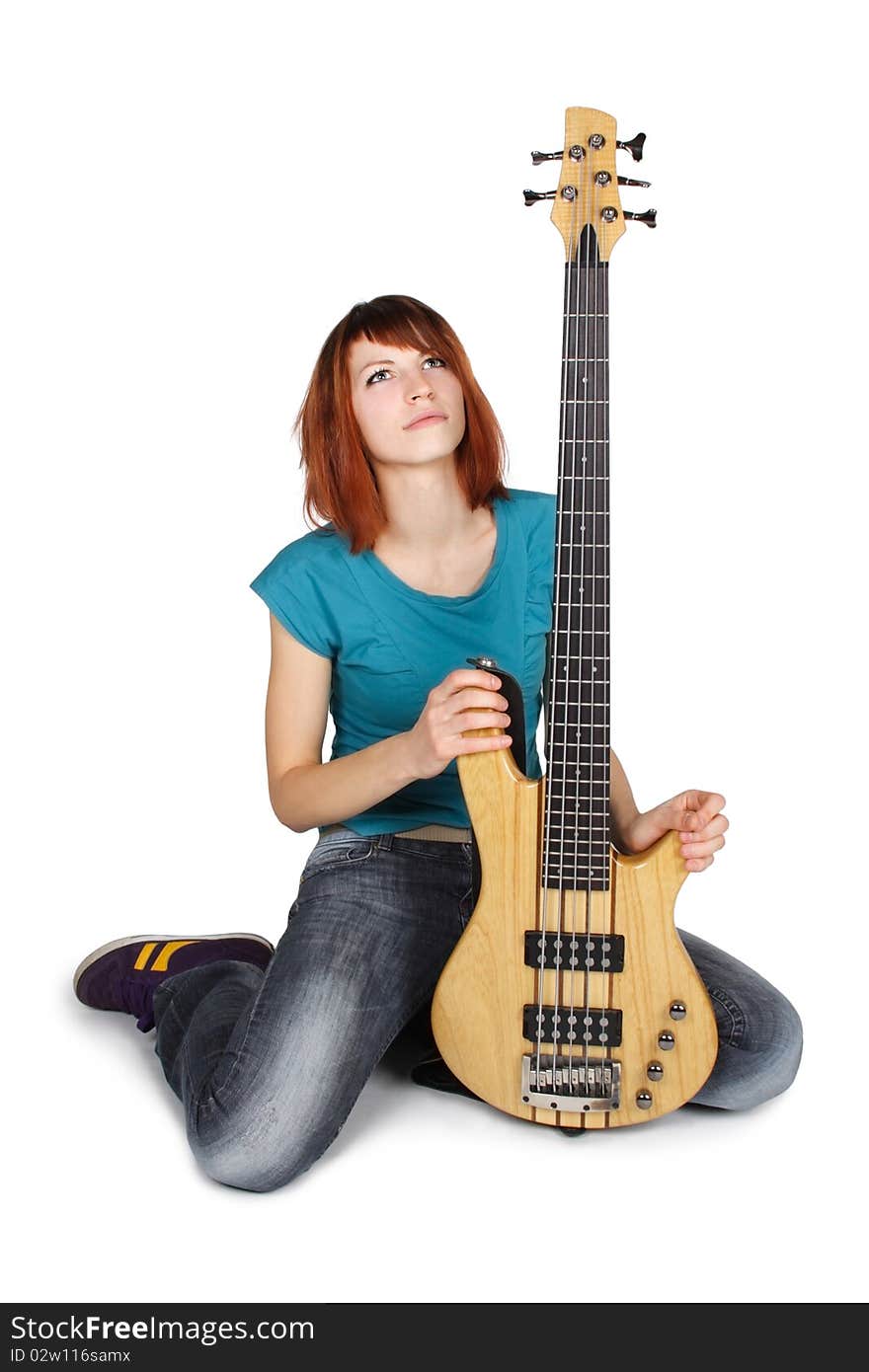 Redhead Girl Sitting And Holding Bass Guitar