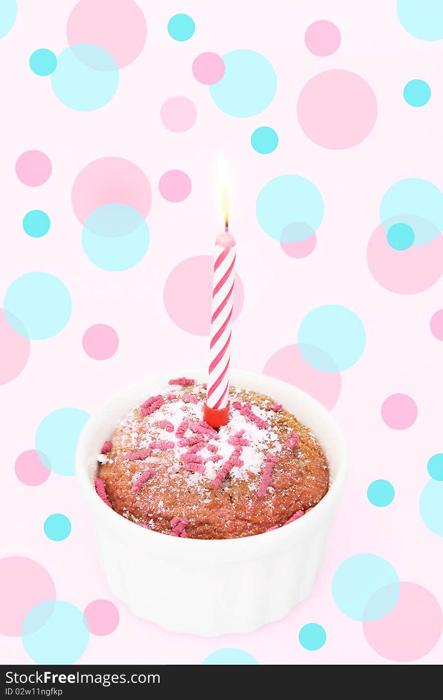 Cupcake and candle on the multicolored background. Cupcake and candle on the multicolored background