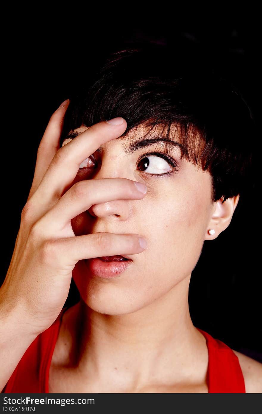 A woman showing her fright with a man's hand over her face. A woman showing her fright with a man's hand over her face.