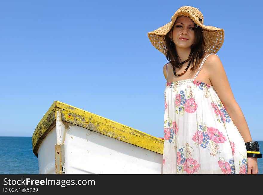 Young woman and rowboat.