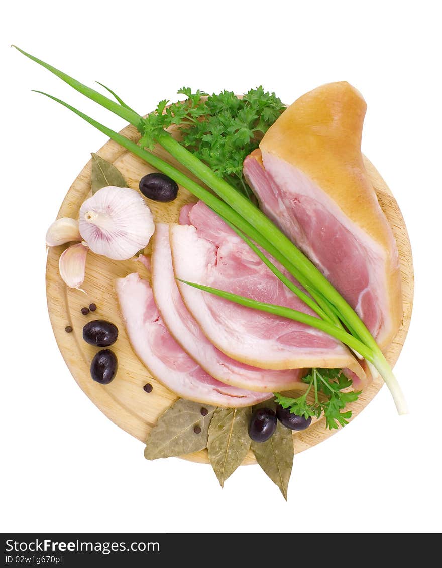 Nice fresh pink bacon with greens and spices isolated on white with clipping path. Nice fresh pink bacon with greens and spices isolated on white with clipping path