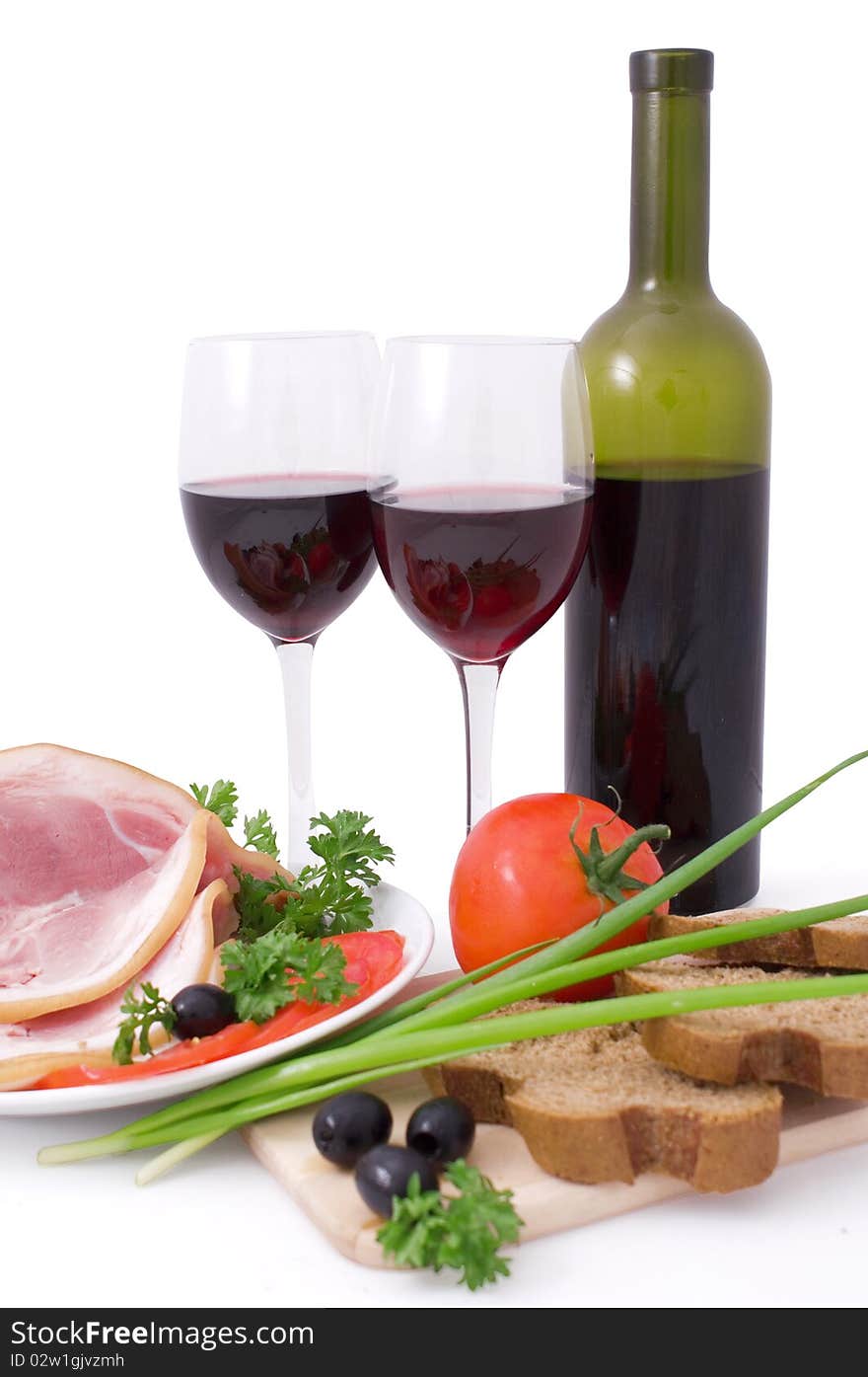 Nice fresh bacon, vegetables; greens, bread and red wine isolated on white with clipping path. Nice fresh bacon, vegetables; greens, bread and red wine isolated on white with clipping path