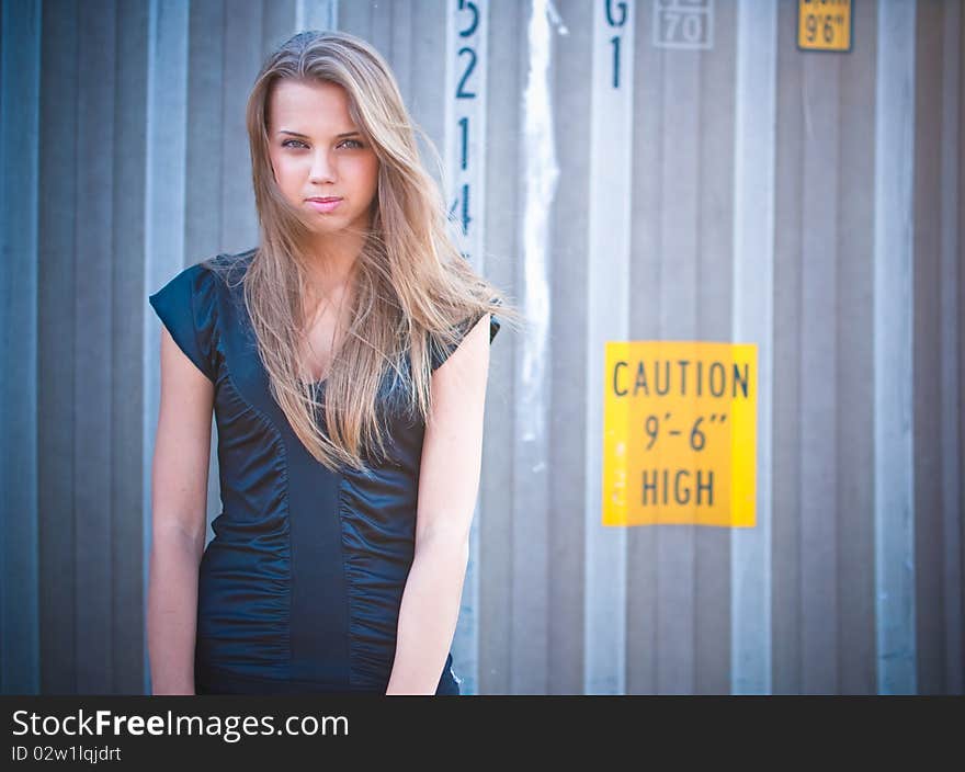 Young girl with the container on the backgrounf. Young girl with the container on the backgrounf