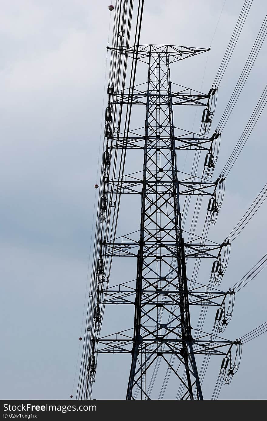 Electric high voltage post with sky background